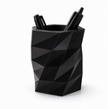 Black geometric pen holder with three pens on a white background