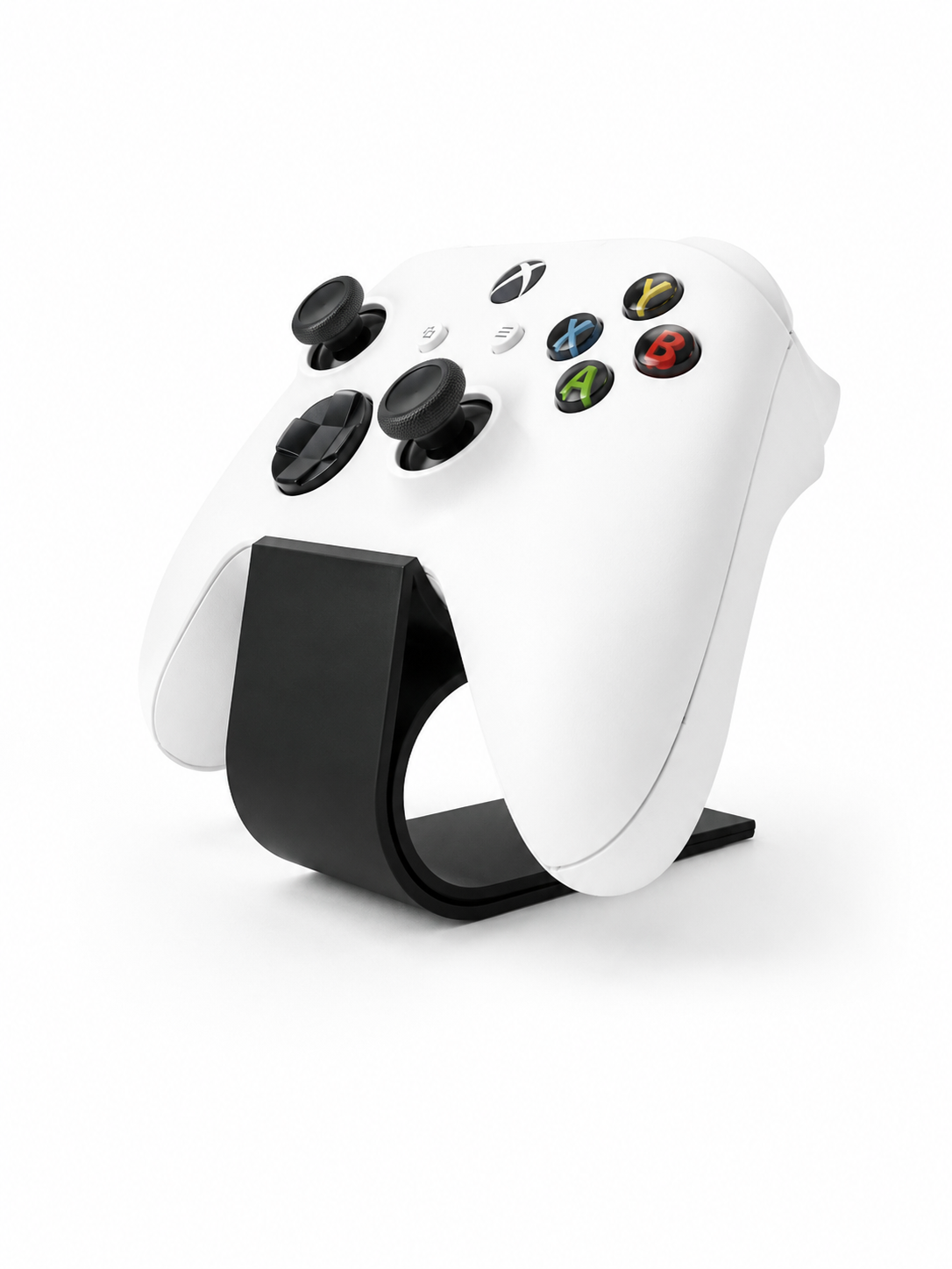 White gaming controller with colorful buttons on a black stand against a white background